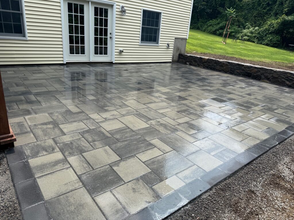 Freshly sealed paver patio installation in South Windsor Connecticut