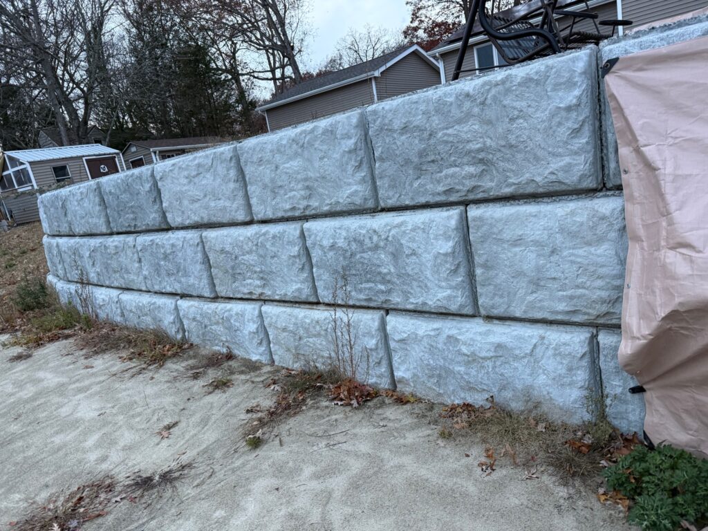 Large concrete block retaining wall construction in Simsbury Connecticut